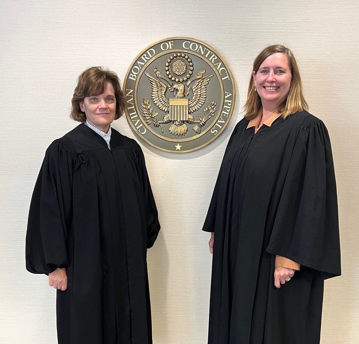 Board Chair Judge Beardsley standing with Judge Elizabeth W. Newsom 